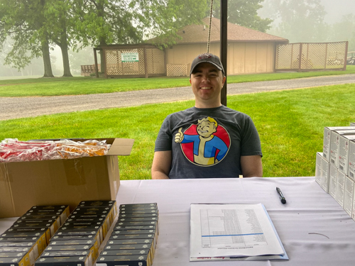 Volunteer sitting at registration table