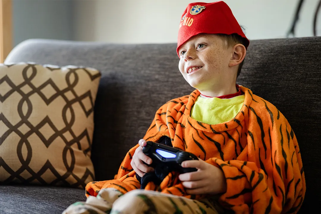Young boy playing video games.